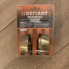 Defiant Deadbolt Keyed Two Side Brass Finish Door Lock New. Price: $10.00.