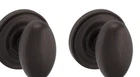 Baldwin Dummy Knob With Traditional Round Rose 5425.112.FD Venetian Bronze Open. Price: $24.95.