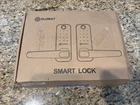 Olumat Smart Door Lock With Handle Keyless Entry + Wifi Gateway, Silver & Black Open. Price: $98.96.