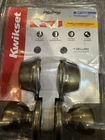 Kwikset Tylo Antique Brass Entry Knob And Double Cylinder Deadbolt Combo 695T Open. Price: $15.00.